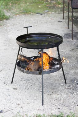 Black grill for cooking on a fire on the street