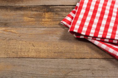Wooden table and kitchen towel. View from above. Culinary concept. Background for cooking recipes