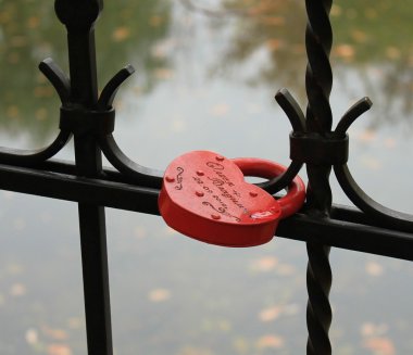 The lock in a shape of a heart. Symbol of love. clipart