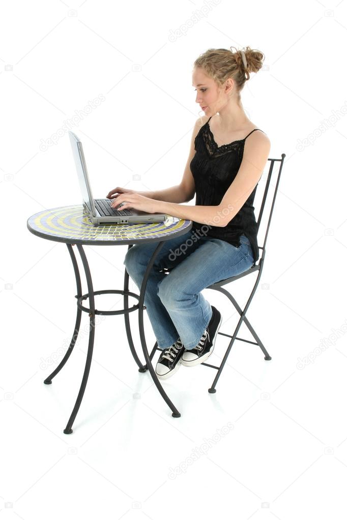 Beautiful Teen Typing on Laptop