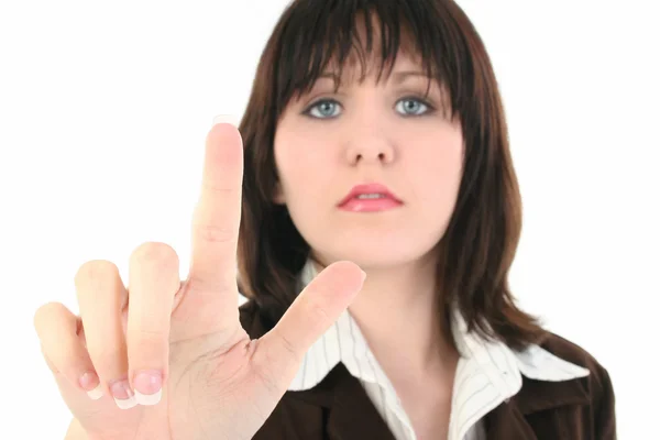 Junge Geschäftsfrau mit erhobenem Zeigefinger — Stockfoto