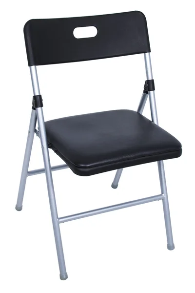Чорний і срібний розкладний стілець над білим — стокове фото