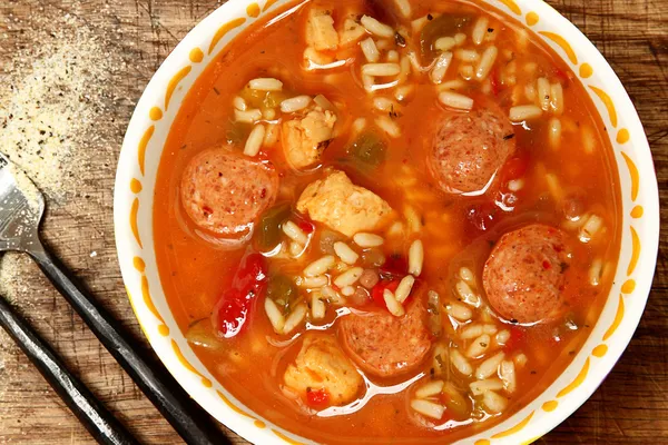 Spicy Cajun Chicken and Sausage Rice Gumbo on Table — Stock Image Spicy Cajun Chicken and Sausage Rice Gumbo on Table Stock Image