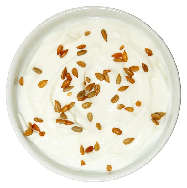 Yogurt con semi di girasole sopra bianco alto angolo vista — Foto Stock