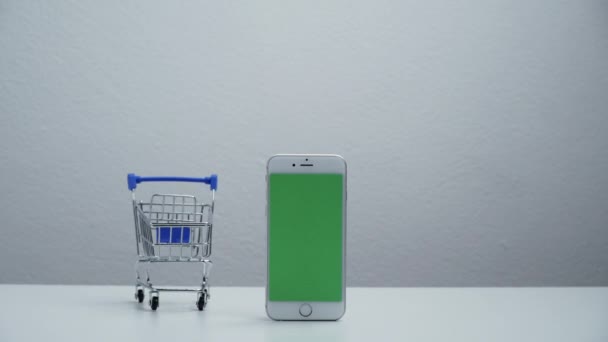 Stop Motion Cart Shopping Moving Smart Phone Green Screen — Stockvideo
