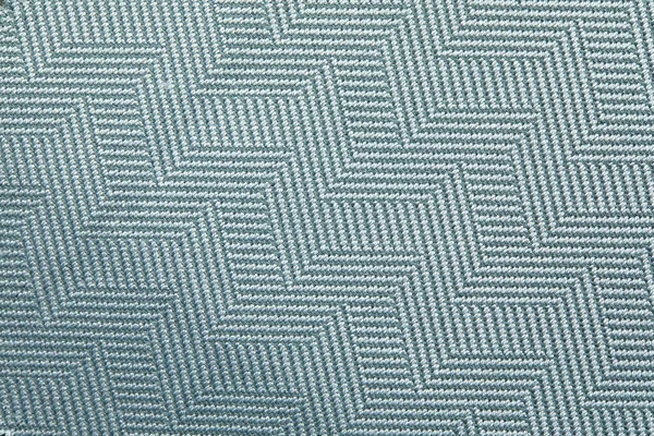 Tekstur rajutan. Tekstur kain jacquard dengan abu-abu biru pola geometris. Pola mosaik Crochet. — Stok Foto