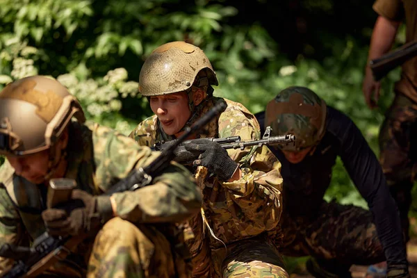 Soldiers game on military training ground battle camp. Action. Operation Trainer giving training to military soldiers at boot camp.