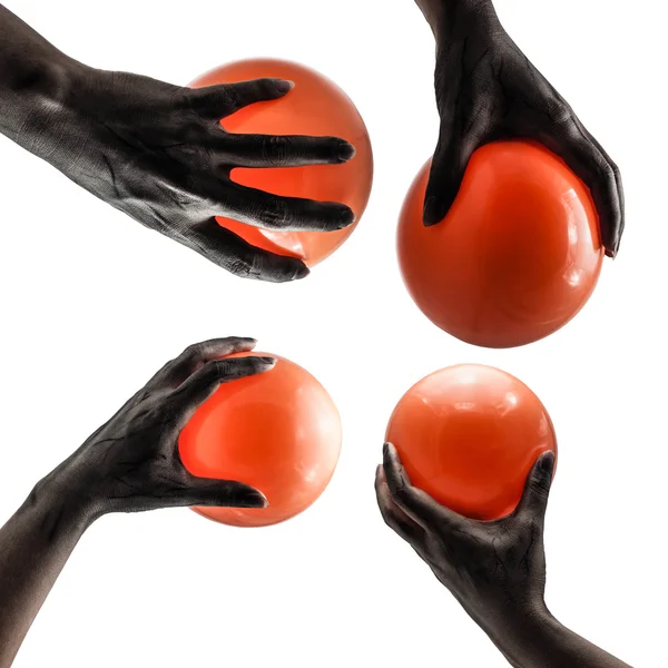 Рука-призрак с оранжевыми шариками — стоковое фото