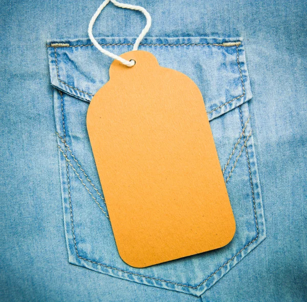 Texture denim con etichetta in carta jeans — Foto Stock