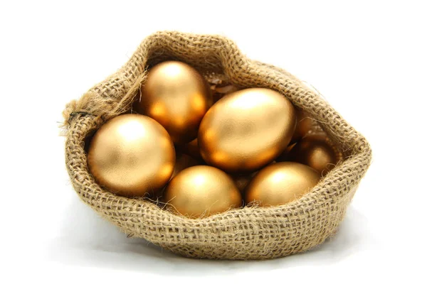 Golden egg in canvas sack — Stock Photo, Image