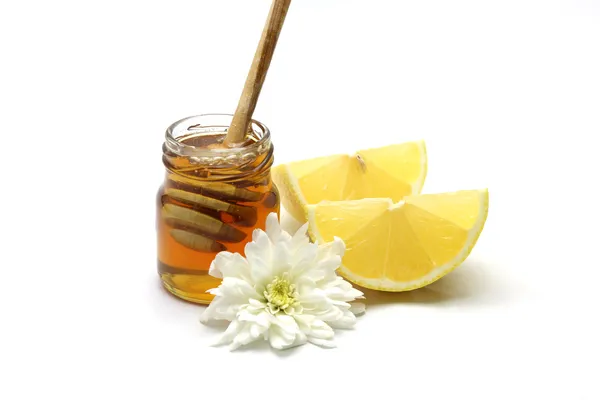 Honing en citroen op witte achtergrond — Stockfoto