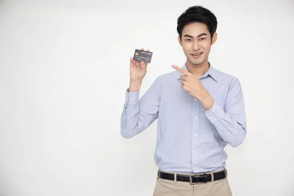 Young Asian Man Smiling Showing Presenting Credit Card Making Payment — Photo