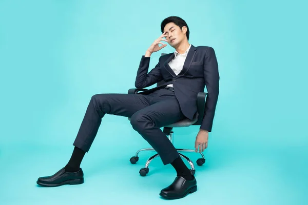 Young Asian Businessman Exhausted Frustrated Sitting Chair Office Isolated Green —  Fotos de Stock