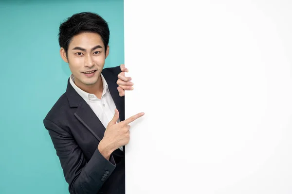 Young Asian Man Suit Standing Blank White Billboard Pointing Finger — Photo
