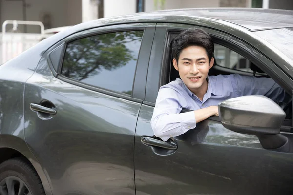 Smiling Asian Businessman Driving Car Looking Window — Photo