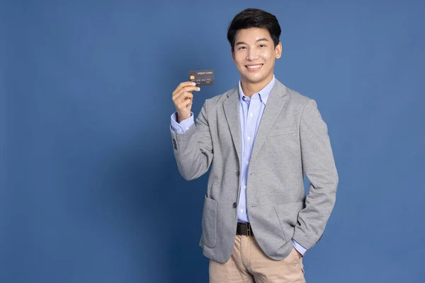 Startup Asian Businessman Showing Credit Card Isolated Blue Background — Photo