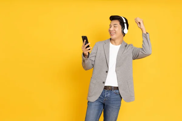 Young Asian Man Listening Favourite Music Mobile Phone Application Wireless — Stok fotoğraf