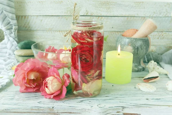 Fresh Rose Flowers Petal Tincture Sea Shells Stones Burning Candles — Foto de Stock