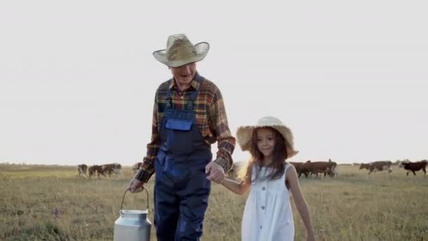 Happy old man, child girl together walk outdoor, healthy natural cow milk, dairy — Stock Video