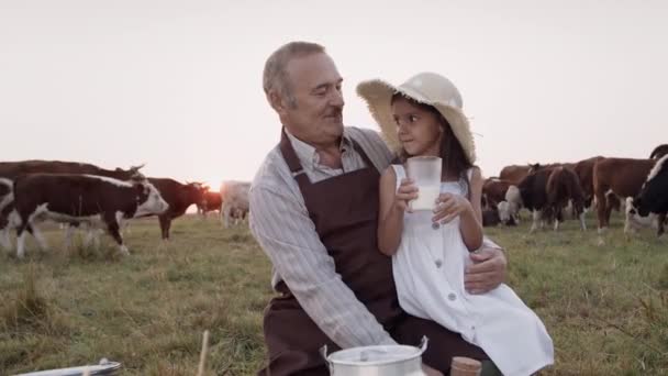 Happy family hug, child girl, loving grandfather drink healthy natural cow milks