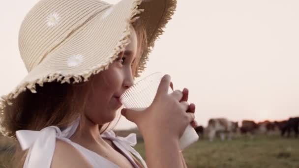 Happy little girl drink healthy natural cow milk, proper nutrition for children — Stockvideo