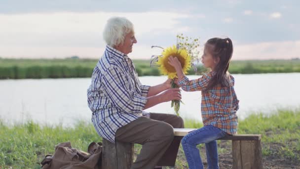Happy Family Relax Old Affectionate Grandmother Help Curious Small Granddaughter — Wideo stockowe