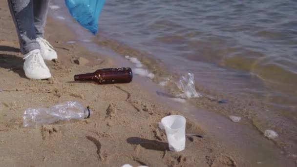 Woman Picks Plastic Bags Bottles Scattered Wet Sand Seashore Avoid — Stock video