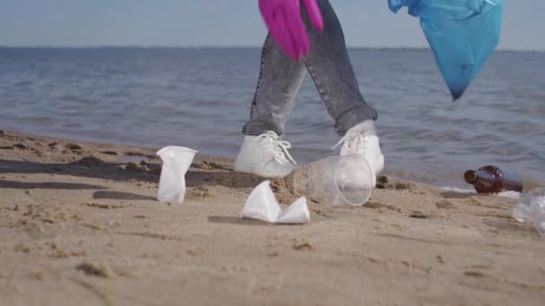 Female Activist Picks Plastic Trash Garbage Bag Walking Sand Public — Stock videók