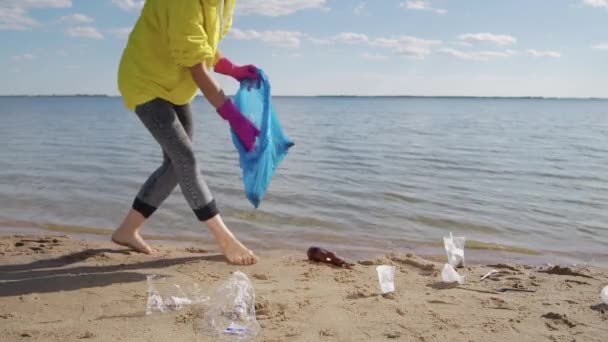 Young Woman Picks Plastic Rubbish Puts Garbage Bag Walking Barefoot — Stock video