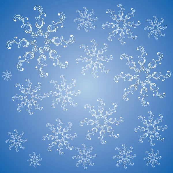 Christmas snowflakes on a blue background — Stock Photo, Image