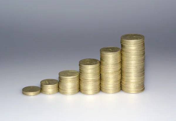 Münzen zeigen steigende Einnahmen — Stockfoto