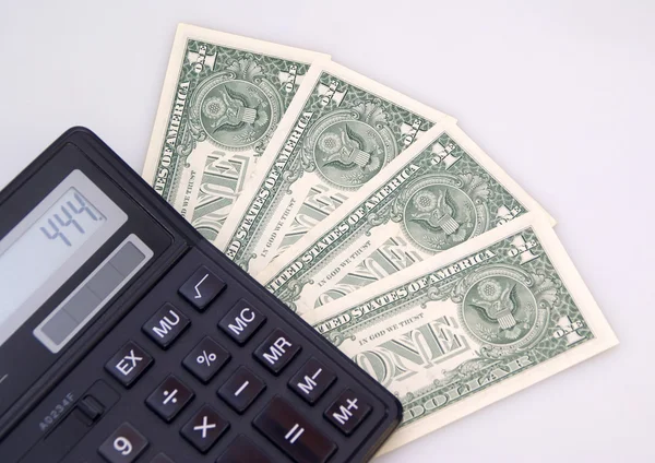 Counting dollars on calculator — Stock Photo, Image