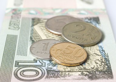 The ruble coins on a banknote clipart