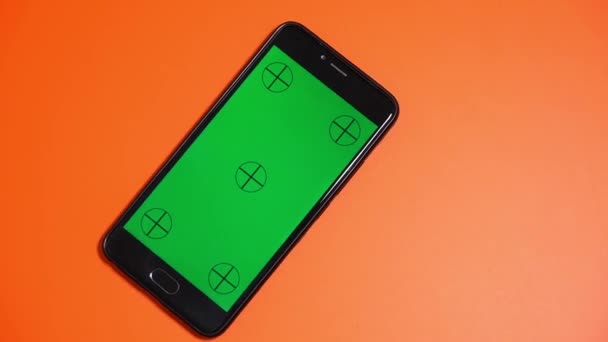 Phone Green Screen Rotates Orange Background — Stock Video