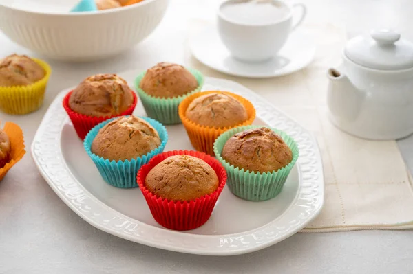 Delicious Golden Homemade Muffins Colorful Paper Cups Plate White Background — 스톡 사진