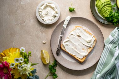 Toasted bread with cream cheese and avocado. Healthy food concept