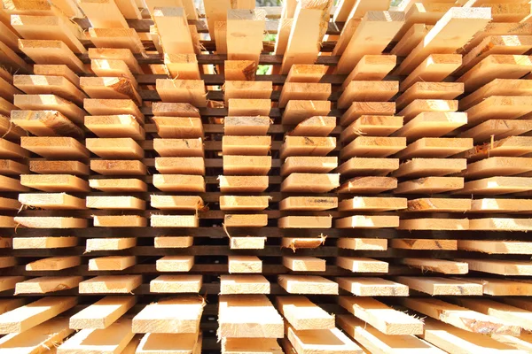 Stacked lumber background — Stock Photo, Image