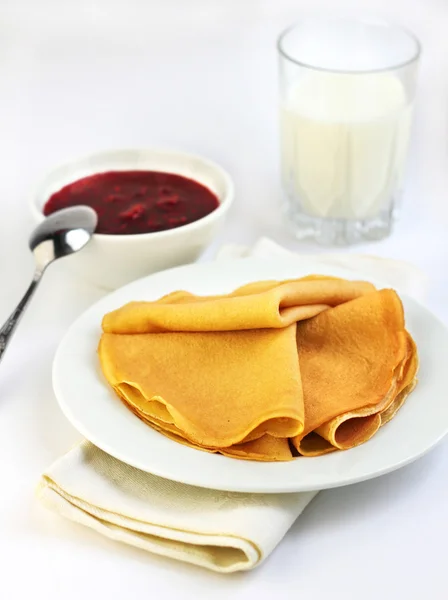 Crepes with confiture and milk on background — Stock Photo, Image