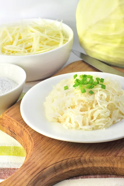 Sauerkraut and ingredients for making it — Stock Photo, Image