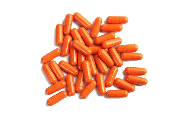 Capsules de pilule orange isolées sur fond blanc — Photo