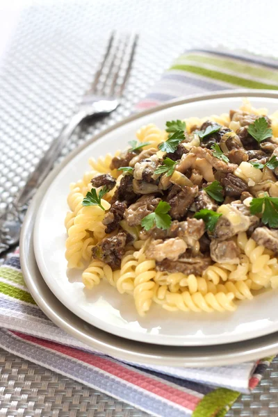 Spiral pasta with morel mushrooms — Stock Photo, Image