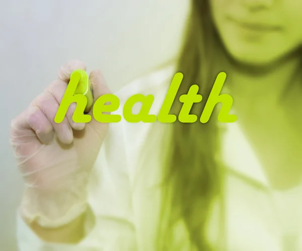 Woman writing Health word — Stock Photo, Image