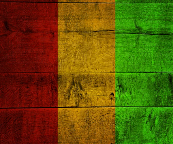 Gwinea Flag on Wood — Stock Photo, Image
