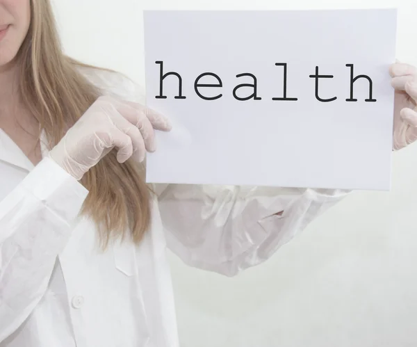 Doctor Holding Health Sign — Stock Photo, Image