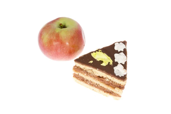 Leckeren Kuchen und Apfel auf weißem Hintergrund — Stockfoto