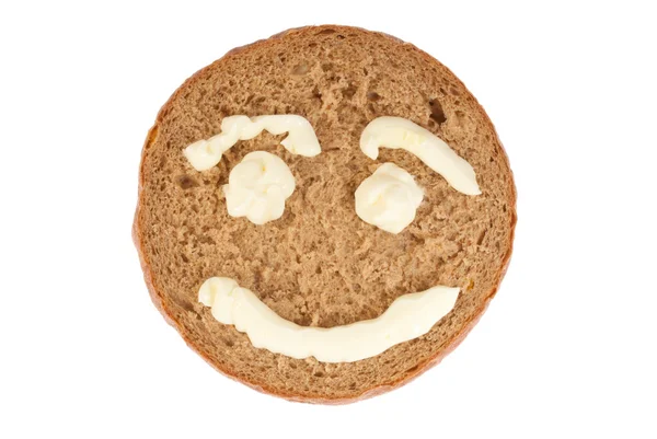 Rodada de pão de centeio com sorriso retratado — Fotografia de Stock