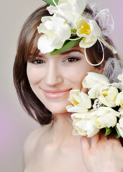 Beautiful young woman with flower — Stock Photo, Image