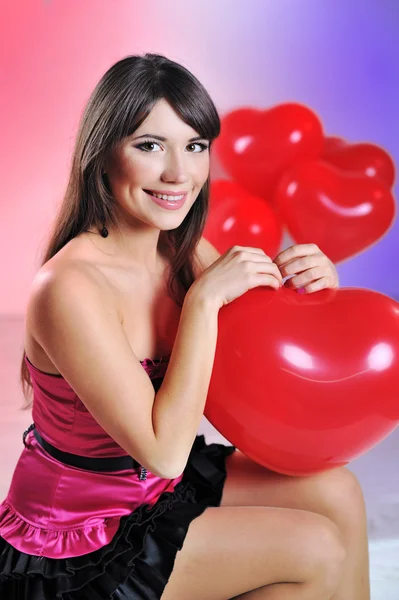 Valentines day woman holding red heart balloon — Stock Photo, Image