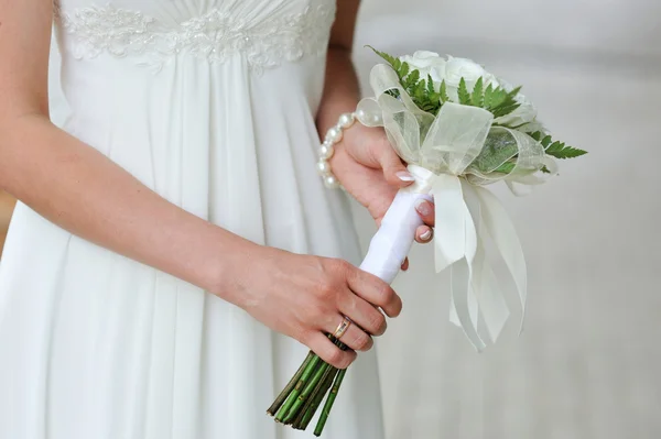 Bride holding wedding flower bouquet of white roses — Stok fotoğraf