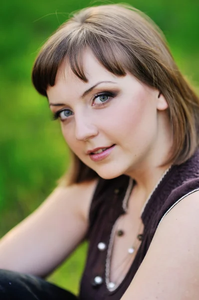 Beautiful girl on the nature near flowering trees — Stock Photo, Image